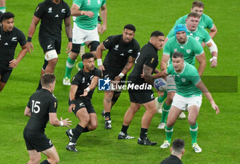2023-10-14 - Richie Mo'unga of New Zealand passes the ball, Johnny Sexton of Ireland during the World Cup 2023, Quarter-final rugby union match between Ireland and New Zealand on October 14, 2023 at Stade de France in Saint-Denis near Paris, France - RUGBY - WORLD CUP 2023 - 1/4 - IRELAND V NEW ZEALAND - WORLD CUP - RUGBY