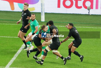 2023-10-14 - Garry Ringrose of Ireland is tackled during the World Cup 2023, Quarter-final rugby union match between Ireland and New Zealand on October 14, 2023 at Stade de France in Saint-Denis near Paris, France - RUGBY - WORLD CUP 2023 - 1/4 - IRELAND V NEW ZEALAND - WORLD CUP - RUGBY