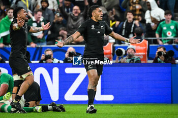 2023-10-14 - Ardie SAVEA of New Zealand and Rieko IOANE of New Zealand celebrate the victory during the World Cup 2023, Quarter-final rugby union match between Ireland and New Zealand on October 14, 2023 at Stade de France in Saint-Denis near Paris, France - RUGBY - WORLD CUP 2023 - 1/4 - IRELAND V NEW ZEALAND - WORLD CUP - RUGBY