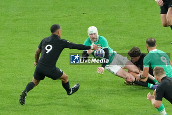 2023-10-14 - Mack Hansen of Ireland and Aaron Smith, Scott Barrett of New Zealand during the World Cup 2023, Quarter-final rugby union match between Ireland and New Zealand on October 14, 2023 at Stade de France in Saint-Denis near Paris, France - RUGBY - WORLD CUP 2023 - 1/4 - IRELAND V NEW ZEALAND - WORLD CUP - RUGBY