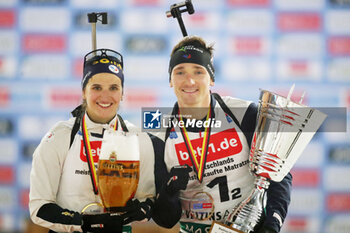 2023-12-28 - Julia Simon and Fabien Claude of France 1st place during the 2023 World Team Challenge, Biathlon event on December 28, 2023 at Veltins-Arena in Gelsenkirchen, Germany - BIATHLON - WORLD TEAM CHALLENGE 2023 - BIATHLON - WINTER SPORTS