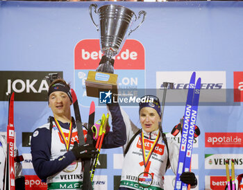 2023-12-28 - Fabien Claude and Julia Simon of France 1st place during the 2023 World Team Challenge, Biathlon event on December 28, 2023 at Veltins-Arena in Gelsenkirchen, Germany - BIATHLON - WORLD TEAM CHALLENGE 2023 - BIATHLON - WINTER SPORTS