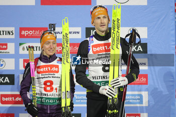 2023-12-28 - Polona Klemencic and Jakov Fak of Slovenia 3rd place during the 2023 World Team Challenge, Biathlon event on December 28, 2023 at Veltins-Arena in Gelsenkirchen, Germany - BIATHLON - WORLD TEAM CHALLENGE 2023 - BIATHLON - WINTER SPORTS