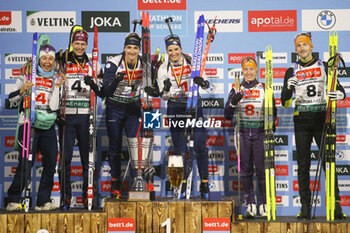 2023-12-28 - Ingris Landmark Tandrevold and Sturla Holm Laegreid of Norway 2nd place, Fabien Claude and Julia Simon of France 1st place, Polona Klemencic and Jakov Fak of Slovenia 3rd place during the 2023 World Team Challenge, Biathlon event on December 28, 2023 at Veltins-Arena in Gelsenkirchen, Germany - BIATHLON - WORLD TEAM CHALLENGE 2023 - BIATHLON - WINTER SPORTS
