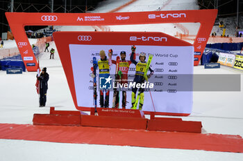 2023-12-22 - (L to R) Clement Noel (FRA) second place, Marco Schwarz (AUT) first place and Dave Ryding (GBR) third place of the competes during the Audi FIS Alpine Ski World Cup, Men’s Slalom race on 3Tre Slope in Madonna di Campiglio on December 22, 2023, Trento, Italy. - AUDI FIS SKI WORLD CUP - MEN'S SLALOM - ALPINE SKIING - WINTER SPORTS