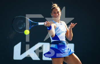 2023-01-16 - Panna Udvardy of Hungary in action against Camila Osorio of Colombia during the first round of the 2023 Australian Open, Grand Slam tennis tournament on January 16, 2023 in Melbourne, Australia - TENNIS - WTA - AUSTRALIA OPEN 2023 - WEEK 1 - INTERNATIONALS - TENNIS