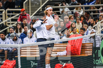 2023-02-04 - STEFANOS TSITSIPAS of Greece with Captain DIMITRIS CHATZINIKOLAOU during day one of the Davis Cup World Group I Play-off between Greece and Ecuador at Olympic Athletic Center of Athens 