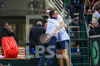 2023-02-05 - STEFANOS TSITSIPAS of Greece celebrating Captain DIMITRIS CHATZINIKOLAOU after winning the game during day two of the Davis Cup World Group I Play-off between Greece and Ecuador at Olympic Athletic Center of Athens 