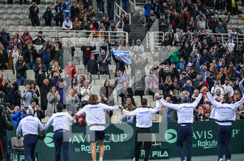 2023-02-05 - STEFANOS TSITSIPAS of Greece celebrating with teammates after winning the game during day two of the Davis Cup World Group I Play-off between Greece and Ecuador at Olympic Athletic Center of Athens 