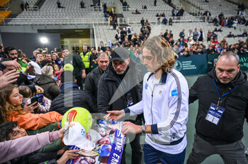 2023-02-05 - STEFANOS TSITSIPAS of Greece signing autographs after winning the game during day two of the Davis Cup World Group I Play-off between Greece and Ecuador at Olympic Athletic Center of Athens 