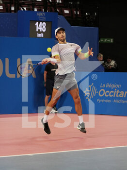 2023-02-09 - Borna Coric (CRO) in action against Arthur Rinderknech (FRA) during the Open Sud de France 2023, ATP 250 tennis tournament on February 9, 2023 at Sud de France Arena in Pérols near Montpellier, France - TENNIS - ATP - OPEN SUD DE FRANCE 2023 - INTERNATIONALS - TENNIS