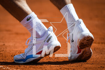 2023-04-08 - Detail of Mizuno shoes during the Rolex Monte-Carlo, ATP Masters 1000 tennis event on April 8, 2023 at Monte-Carlo Country Club in Roquebrune Cap Martin, France - TENNIS - ROLEX MONTE CARLO MASTERS 2023 - INTERNATIONALS - TENNIS
