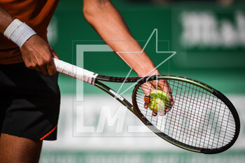 2023-04-12 - Illustration of a tennis racket with a ball during the Rolex Monte-Carlo, ATP Masters 1000 tennis event on April 12, 2023 at Monte-Carlo Country Club in Roquebrune Cap Martin, France - TENNIS - ROLEX MONTE CARLO MASTERS 2023 - INTERNATIONALS - TENNIS