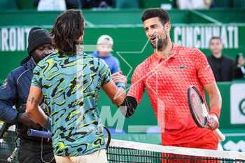 2023-04-13 - Lorenzo MUSETTI of Italia and Novak DJOKOVIC of Serbia during the Rolex Monte-Carlo, ATP Masters 1000 tennis event on April 13, 2023 at Monte-Carlo Country Club in Roquebrune Cap Martin, France - TENNIS - ROLEX MONTE CARLO MASTERS 2023 - INTERNATIONALS - TENNIS