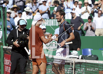 2023-04-14 - Holger Rune of Denmark shakes hands with Daniil Medvedev of Russia after his victory during day 6 of the Rolex Monte-Carlo Masters 2023, an ATP Masters 1000 tennis event on April 14, 2023 at Monte-Carlo Country Club in Roquebrune Cap Martin, France - TENNIS - ROLEX MONTE CARLO MASTERS 2023 - INTERNATIONALS - TENNIS