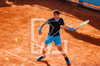 2023-04-25 - Juan Manuel Cerundolo of Argentina in action against Alexander Shevchenko of Russia during the Mutua Madrid Open 2023, Masters 1000 tennis tournament on April 25, 2023 at Caja Magica in Madrid, Spain - TENNIS - MUTUA MADRID OPEN 2023 - INTERNATIONALS - TENNIS