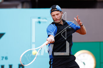 2023-04-26 - Hugo Grenier of France in action against Diego Schwartzman of Argentina during the Mutua Madrid Open 2023, Masters 1000 tennis tournament on April 26, 2023 at Caja Magica in Madrid, Spain - TENNIS - MUTUA MADRID OPEN 2023 - INTERNATIONALS - TENNIS
