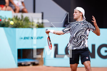 2023-04-26 - Diego Schwartzman of Argentina in action against Hugo Grenier of France during the Mutua Madrid Open 2023, Masters 1000 tennis tournament on April 26, 2023 at Caja Magica in Madrid, Spain - TENNIS - MUTUA MADRID OPEN 2023 - INTERNATIONALS - TENNIS