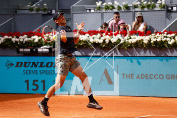 2023-04-27 - Dominic Thiem of Austria in action against Kyle Edmund of Great Britain during the Mutua Madrid Open 2023, Masters 1000 tennis tournament on April 27, 2023 at Caja Magica in Madrid, Spain - TENNIS - MUTUA MADRID OPEN 2023 - INTERNATIONALS - TENNIS