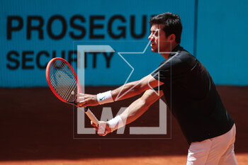 2023-04-27 - Cristian Garin of Chile in action against Marc-Andrea Huesler of Switzerland during the Mutua Madrid Open 2023, Masters 1000 tennis tournament on April 27, 2023 at Caja Magica in Madrid, Spain - TENNIS - MUTUA MADRID OPEN 2023 - INTERNATIONALS - TENNIS