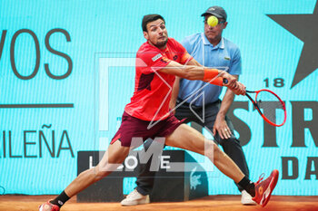 2023-04-27 - Bernabe Zapata Miralles of Spain in action against Mackenzie McDonald of United States during the Mutua Madrid Open 2023, Masters 1000 tennis tournament on April 27, 2023 at Caja Magica in Madrid, Spain - TENNIS - MUTUA MADRID OPEN 2023 - INTERNATIONALS - TENNIS