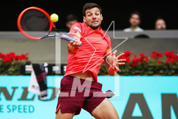 2023-04-27 - Bernabe Zapata Miralles of Spain in action against Mackenzie McDonald of United States during the Mutua Madrid Open 2023, Masters 1000 tennis tournament on April 27, 2023 at Caja Magica in Madrid, Spain - TENNIS - MUTUA MADRID OPEN 2023 - INTERNATIONALS - TENNIS