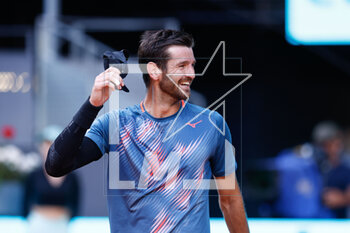 2023-04-27 - Andrea Vavassori of Italy celebrates after winning against Andy Murray of Great Britain during the Mutua Madrid Open 2023, Masters 1000 tennis tournament on April 27, 2023 at Caja Magica in Madrid, Spain - TENNIS - MUTUA MADRID OPEN 2023 - INTERNATIONALS - TENNIS