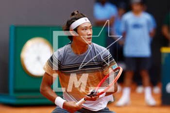 2023-04-29 - Zhizhen Zhang of China in action against Denis Shapovalop of Canada during the Mutua Madrid Open 2023, Masters 1000 tennis tournament on April 29, 2023 at Caja Magica in Madrid, Spain - TENNIS - MUTUA MADRID OPEN 2023 - INTERNATIONALS - TENNIS