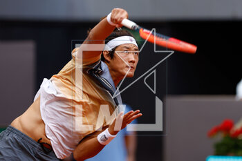 2023-04-29 - Zhizhen Zhang of China in action against Denis Shapovalop of Canada during the Mutua Madrid Open 2023, Masters 1000 tennis tournament on April 29, 2023 at Caja Magica in Madrid, Spain - TENNIS - MUTUA MADRID OPEN 2023 - INTERNATIONALS - TENNIS