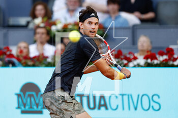 2023-04-29 - Dominic Thiem of Austria in action against Stefanos Tsitsipas of Greece during the Mutua Madrid Open 2023, Masters 1000 tennis tournament on April 29, 2023 at Caja Magica in Madrid, Spain - TENNIS - MUTUA MADRID OPEN 2023 - INTERNATIONALS - TENNIS