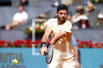 2023-04-30 - Karen Khachanov of Russia in action against Roberto Bautista Agut of Spain during the Mutua Madrid Open 2023, Masters 1000 tennis tournament on April 30, 2023 at Caja Magica in Madrid, Spain - TENNIS - MUTUA MADRID OPEN 2023 - INTERNATIONALS - TENNIS