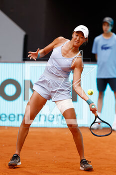 2023-04-30 - Xiyu Wang of China in action against Barbora Krejcikova of Czech Republic during the Mutua Madrid Open 2023, Masters 1000 tennis tournament on April 30, 2023 at Caja Magica in Madrid, Spain - TENNIS - MUTUA MADRID OPEN 2023 - INTERNATIONALS - TENNIS