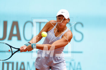 2023-04-30 - Xiyu Wang of China in action against Barbora Krejcikova of Czech Republic during the Mutua Madrid Open 2023, Masters 1000 tennis tournament on April 30, 2023 at Caja Magica in Madrid, Spain - TENNIS - MUTUA MADRID OPEN 2023 - INTERNATIONALS - TENNIS