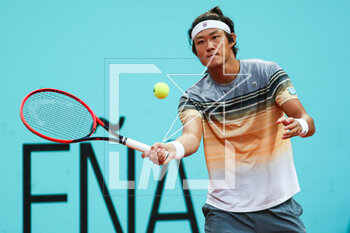 2023-05-01 - Zhizhen Zhang of China in action against Cameron Norrie of United Kingdom during the Mutua Madrid Open 2023, Masters 1000 tennis tournament on May 1, 2023 at Caja Magica in Madrid, Spain - TENNIS - MUTUA MADRID OPEN 2023 - INTERNATIONALS - TENNIS