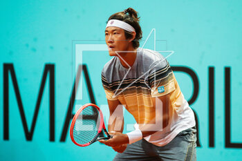 2023-05-01 - Zhizhen Zhang of China in action against Cameron Norrie of United Kingdom during the Mutua Madrid Open 2023, Masters 1000 tennis tournament on May 1, 2023 at Caja Magica in Madrid, Spain - TENNIS - MUTUA MADRID OPEN 2023 - INTERNATIONALS - TENNIS