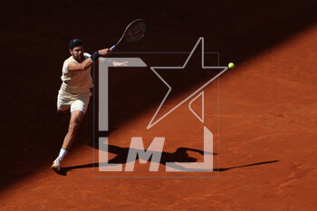 2023-05-02 - Karen Khachanov (Rus) in action against Andrey Rublev (Rus) during the Mutua Madrid Open 2023, Masters 1000 tennis tournament on May 2, 2023 at Caja Magica in Madrid, Spain - TENNIS - MUTUA MADRID OPEN 2023 - INTERNATIONALS - TENNIS