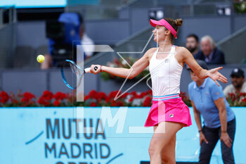 2023-05-02 - Irina Camelia Begu of Romania in action against Maria Sakkari of Greece during the Mutua Madrid Open 2023, Masters 1000 tennis tournament on May 2, 2023 at Caja Magica in Madrid, Spain - TENNIS - MUTUA MADRID OPEN 2023 - INTERNATIONALS - TENNIS