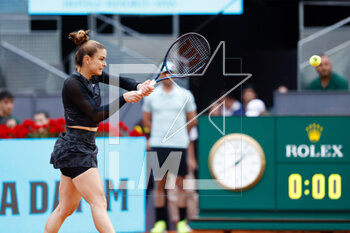 2023-05-02 - Maria Sakkari of Greece in action against Irina Camelia Begu of Romania during the Mutua Madrid Open 2023, Masters 1000 tennis tournament on May 2, 2023 at Caja Magica in Madrid, Spain - TENNIS - MUTUA MADRID OPEN 2023 - INTERNATIONALS - TENNIS