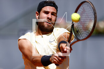 2023-05-02 - Karen Khachanov of Russia in action against Andrey Rublev of Russia during the Mutua Madrid Open 2023, Masters 1000 tennis tournament on May 2, 2023 at Caja Magica in Madrid, Spain - TENNIS - MUTUA MADRID OPEN 2023 - INTERNATIONALS - TENNIS