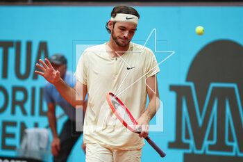 2023-05-02 - Taylor Fritz of United States in action against Zhizhen Zhang of China during the Mutua Madrid Open 2023, Masters 1000 tennis tournament on May 2, 2023 at Caja Magica in Madrid, Spain - TENNIS - MUTUA MADRID OPEN 2023 - INTERNATIONALS - TENNIS