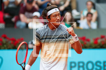 2023-05-02 - Zhizhen Zhang of China in action against Taylor Fritz of United States during the Mutua Madrid Open 2023, Masters 1000 tennis tournament on May 2, 2023 at Caja Magica in Madrid, Spain - TENNIS - MUTUA MADRID OPEN 2023 - INTERNATIONALS - TENNIS