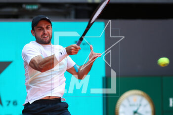 2023-05-02 - Aslan Karatsev of Russia in action against Daniil Medvedev of Russia during the Mutua Madrid Open 2023, Masters 1000 tennis tournament on May 2, 2023 at Caja Magica in Madrid, Spain - TENNIS - MUTUA MADRID OPEN 2023 - INTERNATIONALS - TENNIS