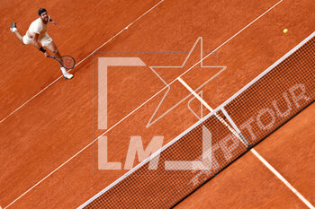 2023-05-03 - Karen Khachanov of Russia in action against Carlos Alcaraz of Spain during the Mutua Madrid Open 2023, Masters 1000 tennis tournament on May 3, 2023 at Caja Magica in Madrid, Spain - TENNIS - MUTUA MADRID OPEN 2023 - INTERNATIONALS - TENNIS