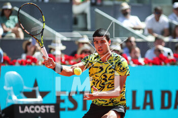 2023-05-05 - Carlos Alcaraz of Spain in action against Borna Coric of Croatia during the Mutua Madrid Open 2023, Masters 1000 tennis tournament on May 5, 2023 at Caja Magica in Madrid, Spain - TENNIS - MUTUA MADRID OPEN 2023 - INTERNATIONALS - TENNIS