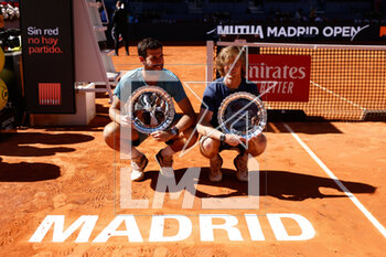 2023-05-06 - Andrey Rublev and Karen Khachanov of Russia pose for photo with the winners trophy after winning against Rohan Bopanna of India and Mathew Ebden of Australia during the Doubles Final Men match during the Mutua Madrid Open 2023, Masters 1000 tennis tournament on May 6, 2023 at Caja Magica in Madrid, Spain - TENNIS - MUTUA MADRID OPEN 2023 - INTERNATIONALS - TENNIS