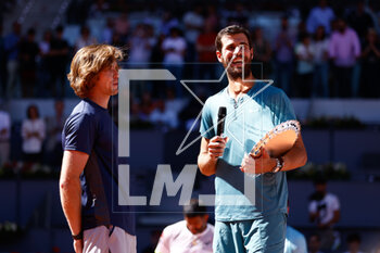 2023-05-06 - Andrey Rublev and Karen Khachanov of Russia attend with the winners trophy after winning against Rohan Bopanna of India and Mathew Ebden of Australia during the Mutua Madrid Open 2023, Masters 1000 tennis tournament on May 6, 2023 at Caja Magica in Madrid, Spain - TENNIS - MUTUA MADRID OPEN 2023 - INTERNATIONALS - TENNIS