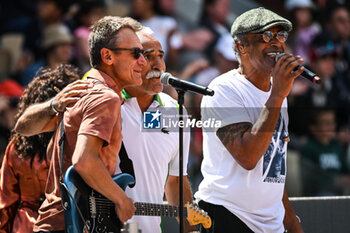 2023-05-27 - French singer and former tennis player Yannick NOAH with former Swedish tennis player Mats WILANDER and former Iranian tennis player Mansour BAHRAMI perform on stage during a concert at Roland-Garros 2023, Grand Slam tennis tournament, Previews on May 27, 2023 at Roland-Garros stadium in Paris, France - TENNIS - ROLAND GARROS 2023 - PREVIEWS - INTERNATIONALS - TENNIS