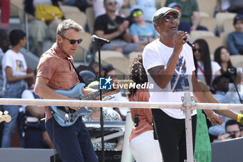 2023-05-27 - Yannick Noah of France performs - here with Mats Wilander of Sweden with his guitar (left) - during a concert on Central Court 40 years after his victory at the French Open 1983 (against Wilander) during Kids' Day now baptised 'Yannick Noah Day' on the eve of the French Open 2023, second Grand Slam tennis tournament of the season on May 27, 2023 at stade Roland-Garros in Paris, France - TENNIS - ROLAND GARROS 2023 - PREVIEWS - INTERNATIONALS - TENNIS
