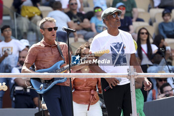 2023-05-27 - Yannick Noah of France performs - here with Mats Wilander of Sweden with his guitar (left) - during a concert on Central Court 40 years after his victory at the French Open 1983 (against Wilander) during Kids' Day now baptised 'Yannick Noah Day' on the eve of the French Open 2023, second Grand Slam tennis tournament of the season on May 27, 2023 at stade Roland-Garros in Paris, France - TENNIS - ROLAND GARROS 2023 - PREVIEWS - INTERNATIONALS - TENNIS