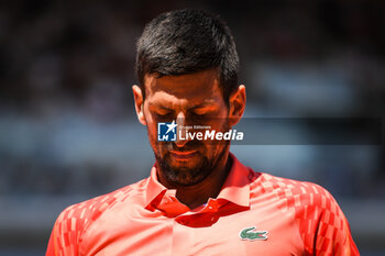 2023-06-02 - Novak DJOKOVIC of Serbia looks dejected during the sixth day of Roland-Garros 2023, Grand Slam tennis tournament, on June 02, 2023 at Roland-Garros stadium in Paris, France - TENNIS - ROLAND GARROS 2023 - WEEK 1 - INTERNATIONALS - TENNIS
